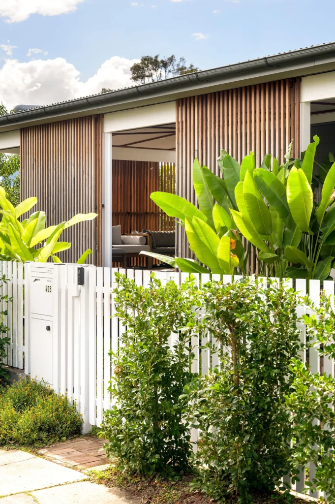 Street view of house with timber screen and plants